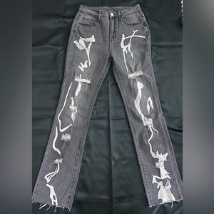 Distressed Black Jeans with Design 

Size: Medium 
Condition: New